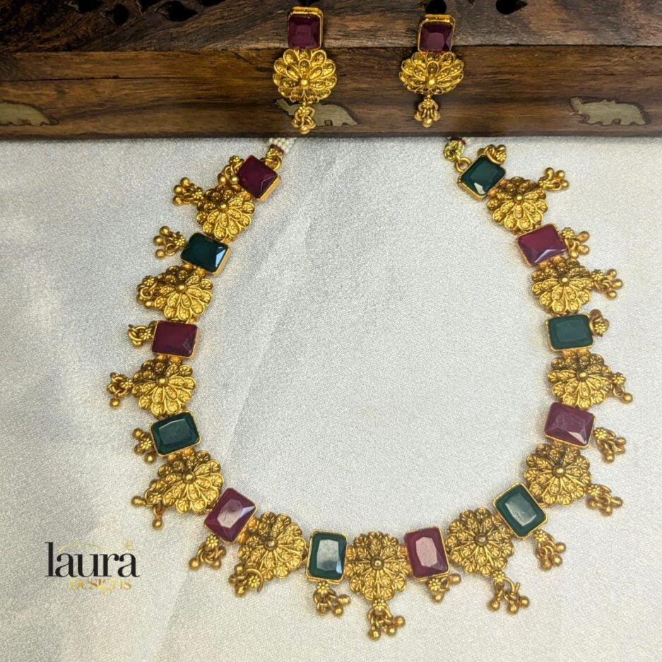 Traditional neckpiece with ruby pink and green stones