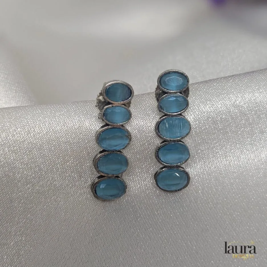 light blue studs